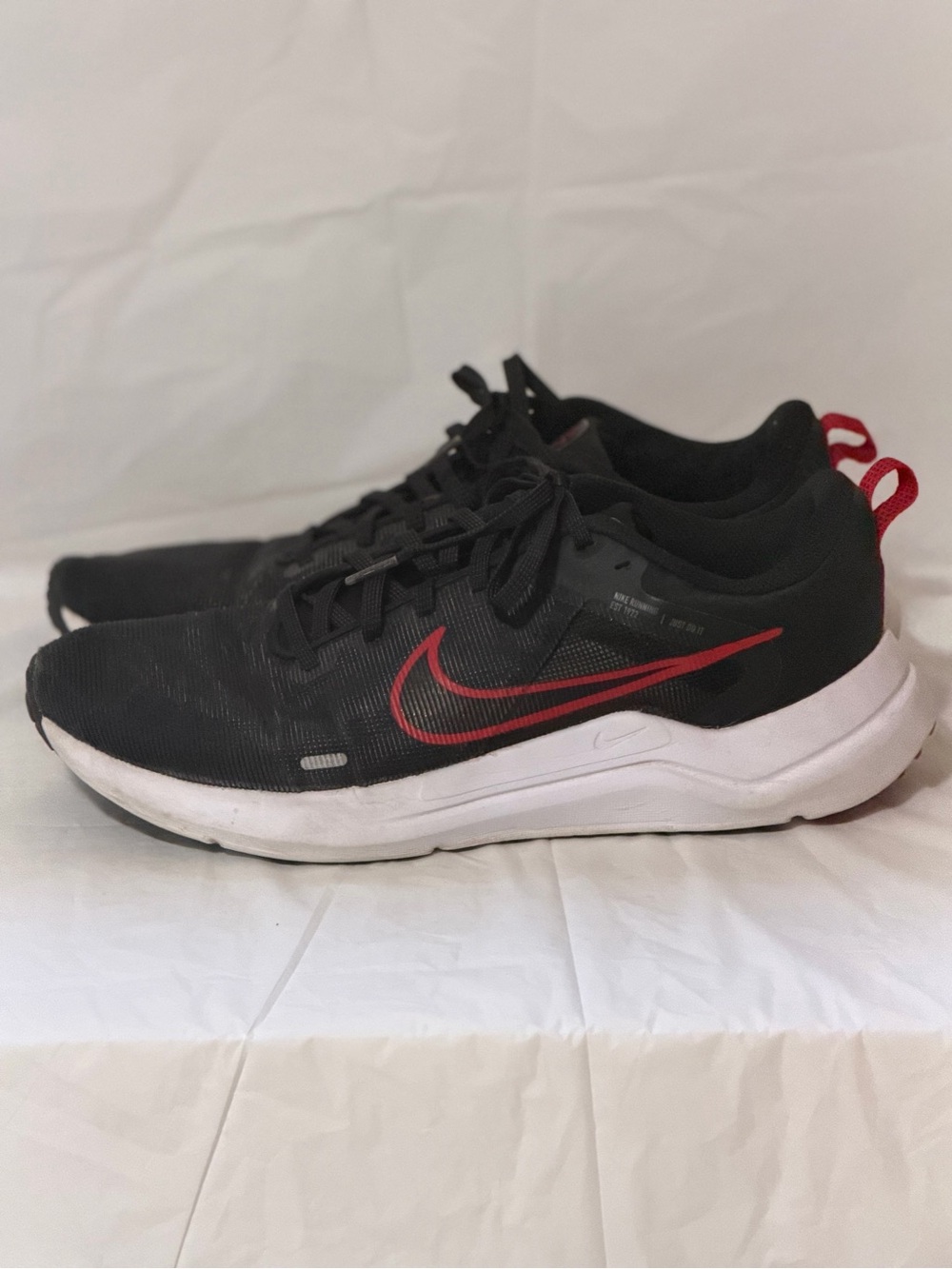 Nike Men's Black Trainers with Red Swoosh and White Midsole